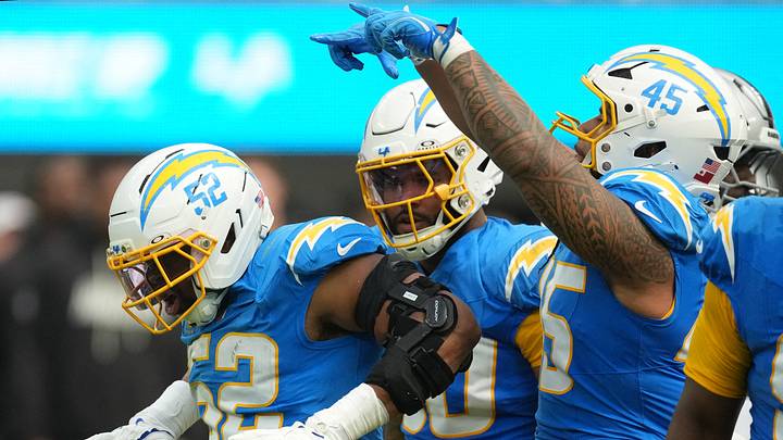 Sep 20, 2026; Inglewood, California, USA; Los Angeles Chargers edge rushers Khalil Mack (52), Akheem Mesidor (90) and Tuli Tuipulotu (45) react after a play against the Las Vegas Raiders during the first half at SoFi Stadium. Mandatory Credit: Kirby Lee-Imagn Images Sep 20, 2026; Inglewood, California, USA; Los Angeles Chargers edge rushers Khalil Mack (52), Akheem Mesidor (90) and Tuli Tuipulotu (45) react after a play against the Las Vegas Raiders during the first half at SoFi Stadium. Mandatory Credit: Kirby Lee-Imagn Images