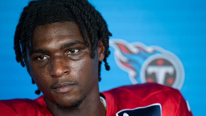 Tennessee Titans quarterback Cam Ward fields questions from the media after practice during training camp.