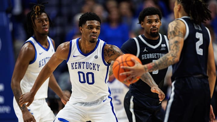 Oct 30, 2025; Lexington, KY, USA; Kentucky Wildcats guard Otega Oweh (00) defends against Georgetown Hoyas guard Malik Mack (2) during the second half at Rupp Arena at Central Bank Center. Mandatory Credit: Jordan Prather-Imagn Images