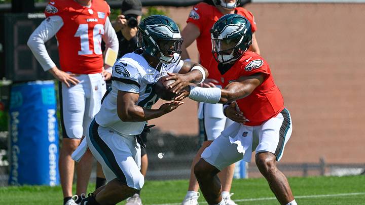 Aug 19, 2026; Foxborough, Massachusetts, USA; New England Patriots quarterback Jalen Hurts (1) hands the ball to running back Saquon Barkley (26) during training camp at Gillette Stadium. Mandatory Credit: Eric Canha-Imagn Images Aug 19, 2026; Foxborough, Massachusetts, USA; New England Patriots quarterback Jalen Hurts (1) hands the ball to running back Saquon Barkley (26) during training camp at Gillette Stadium. Mandatory Credit: Eric Canha-Imagn Images