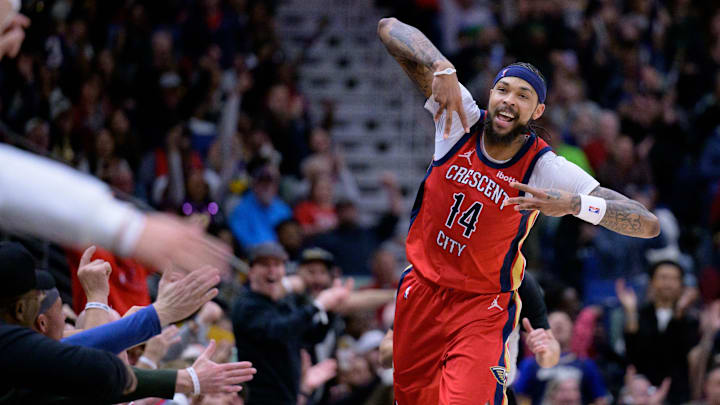 Feb 5, 2024; New Orleans, Louisiana, USA; New Orleans Pelicans forward Brandon Ingram (14) celebrates a three point basket against the Toronto Raptors during the second half at Smoothie King Center. Mandatory Credit: Matthew Hinton-Imagn Images