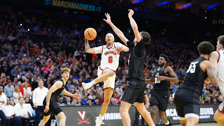Mar 20, 2026; Philadelphia, PA, USA; Virginia Cavaliers guard Jacari White (6) drives to the basket for a lay up as Wright State Raiders forward Kellen Pickett (4) defends during the second half during a first round game of the men's 2026 NCAA Tournament at Xfinity Mobile Arena. Mandatory Credit: Kyle Ross-Imagn Images Mar 20, 2026; Philadelphia, PA, USA; Virginia Cavaliers guard Jacari White (6) drives to the basket for a lay up as Wright State Raiders forward Kellen Pickett (4) defends during the second half during a first round game of the men's 2026 NCAA Tournament at Xfinity Mobile Arena. Mandatory Credit: Kyle Ross-Imagn Images