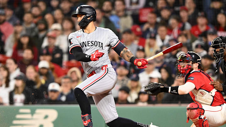 Sep 20, 2024; Boston, Massachusetts, USA; Minnesota Twins shortstop Carlos Correa (4) hits a RBI against the Boston Red Sox during the seventh inning at Fenway Park. Mandatory Credit: Brian Fluharty-Imagn Images