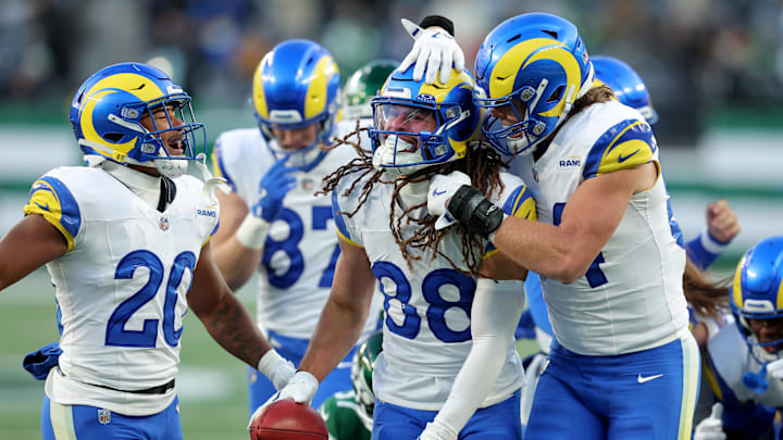 Dec 22, 2024; East Rutherford, New Jersey, USA; Los Angeles Rams wide receiver Jordan Whittington (88) celebrates with running back Ronnie Rivers (20) and tight end Hunter Long (84) after recovering the ball after a muffed punt by the New York Jets during the fourth quarter at MetLife Stadium. Mandatory Credit: Brad Penner-Imagn Images Dec 22, 2024; East Rutherford, New Jersey, USA; Los Angeles Rams wide receiver Jordan Whittington (88) celebrates with running back Ronnie Rivers (20) and tight end Hunter Long (84) after recovering the ball after a muffed punt by the New York Jets during the fourth quarter at MetLife Stadium. Mandatory Credit: Brad Penner-Imagn Images