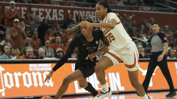 Feb 6, 2025; Austin, Texas, USA; Vanderbilt Commodores guard Mikayla Blakes (1) drives against Texas Longhorns forward Madison Booker (35) during the first half at Moody Center. Mandatory Credit: Scott Wachter-Imagn Images