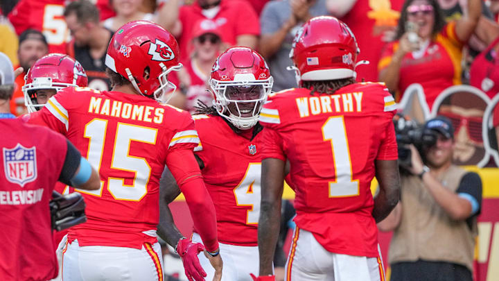 Sep 15, 2024; Kansas City, Missouri, USA; Kansas City Chiefs wide receiver Rashee Rice (4) celebrates after scoring against the Cincinnati Bengals during the game at GEHA Field at Arrowhead Stadium. Mandatory Credit: Denny Medley-Imagn Images