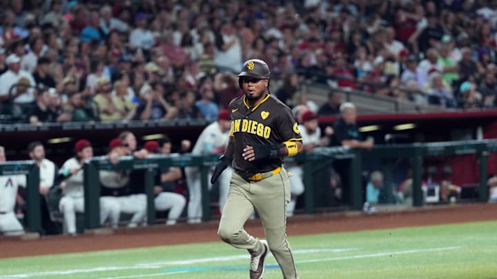Sep 27, 2024; Phoenix, Arizona, USA; San Diego Padres first base Luis Arraez (4) scores a run against the Arizona Diamondbacks during the first inning at Chase Field. Mandatory Credit: Joe Camporeale-Imagn Images