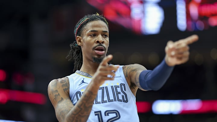 Memphis Grizzlies guard Ja Morant (12) reacts after scoring a basket during the first quarter against the Houston Rockets at Toyota Center. 