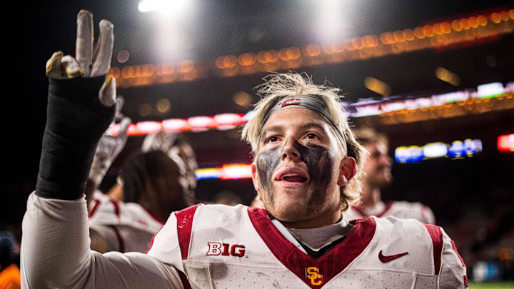Nov 1, 2025; Lincoln, Nebraska, USA; Southern California Trojans linebacker Ryan Quintanar (51) holds up a “V” to fans after defeating the Nebraska Cornhuskers at Memorial Stadium. Mandatory Credit: Dylan Widger-Imagn Images