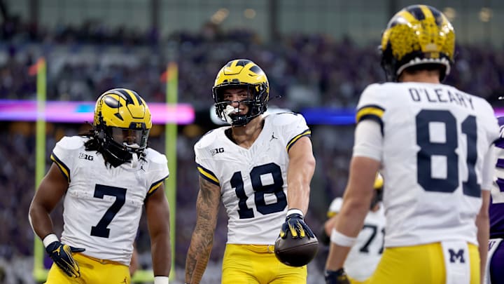 Michigan tight end Colston Loveland celebrates with teammates during Washington's Oct. 5, 2024 victory over the No. 10-ranked Wolverines.