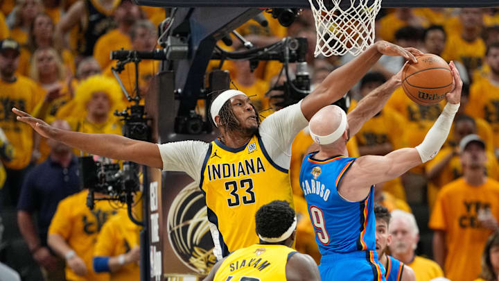 Jun 19, 2025; Indianapolis, Indiana, USA; Indiana Pacers center Myles Turner (33) blocks a shot by Oklahoma City Thunder guard Alex Caruso (9) in the third quarter during game six of the 2025 NBA Finals at Gainbridge Fieldhouse. Mandatory Credit: Kyle Terada-Imagn Images