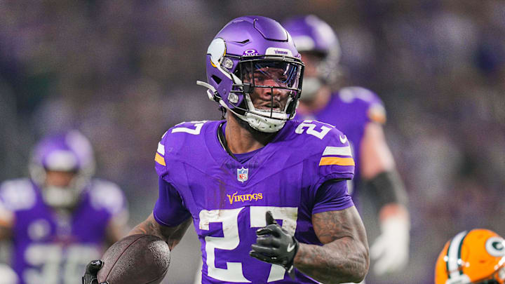 Dec 29, 2024; Minneapolis, Minnesota, USA; Minnesota Vikings running back Cam Akers (27) runs with the ball against Green Bay Packers in the second quarter at U.S. Bank Stadium. Mandatory Credit: Brad Rempel-Imagn Images