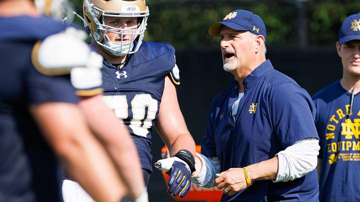 Notre Dame football offensive line coach Joe Rudolph leads a drill during a football practice Notre Dame football offensive line coach Joe Rudolph leads a drill during a football practice