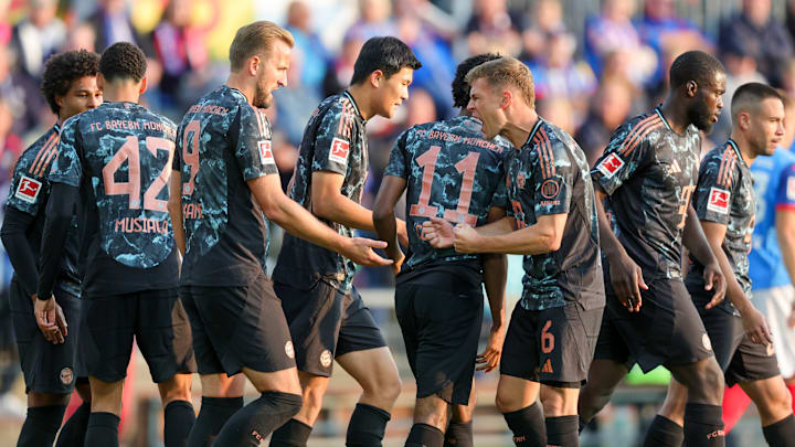 Bayern Munich players celebrating goal against Holstein Kiel.
