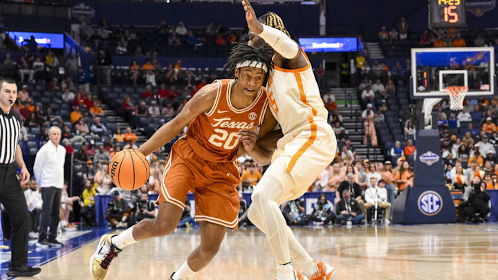 Mar 14, 2025; Nashville, TN, USA; Texas Longhorns guard Tre Johnson (20) drives into Tennessee Volunteers guard Jahmai Mashack (15) during the second half at Bridgestone Arena. Mandatory Credit: Steve Roberts-Imagn Images Mar 14, 2025; Nashville, TN, USA; Texas Longhorns guard Tre Johnson (20) drives into Tennessee Volunteers guard Jahmai Mashack (15) during the second half at Bridgestone Arena. Mandatory Credit: Steve Roberts-Imagn Images