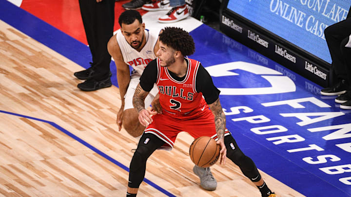 Oct 20, 2021; Detroit, Michigan, USA; Chicago Bulls guard Lonzo Ball (2) as Detroit Pistons forward Trey Lyles (8) defends during the third quarter at Little Caesars Arena. Mandatory Credit: Tim Fuller-Imagn Images
