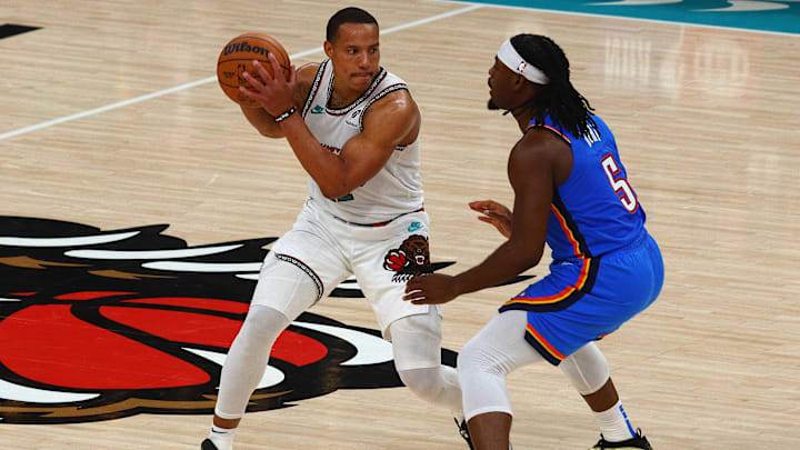 Apr 24, 2025; Memphis, Tennessee, USA; Memphis Grizzlies guard Desmond Bane (22) handles the ball as Oklahoma City Thunder guard Luguentz Dort (5) defends Apr 24, 2025; Memphis, Tennessee, USA; Memphis Grizzlies guard Desmond Bane (22) handles the ball as Oklahoma City Thunder guard Luguentz Dort (5) defends
