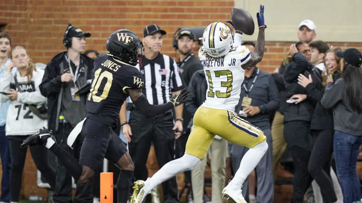 Sep 23, 2023; Winston-Salem, North Carolina, USA;  Georgia Tech Yellow Jackets wide receiver Eric Singleton Jr. (13) makes a touchdown catch during the first half against the Wake Forest Demon Deacons at Allegacy Federal Credit Union Stadium. Mandatory Credit: Jim Dedmon-USA TODAY Sports