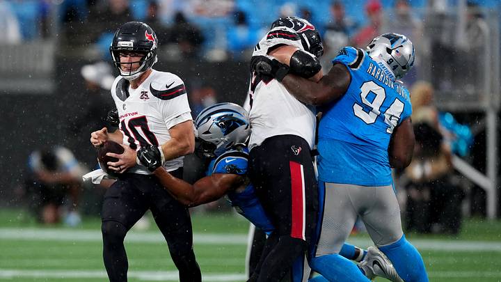 Carolina Panthers linebacker Trevis Gipson (52) sacks Houston Texans quarterback Davis Mills Carolina Panthers linebacker Trevis Gipson (52) sacks Houston Texans quarterback Davis Mills