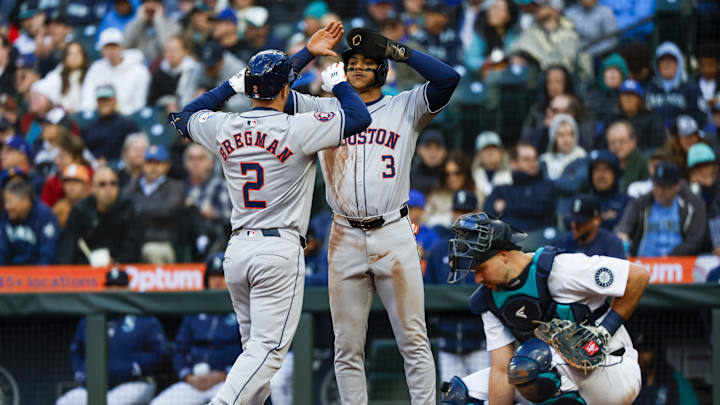 May 28, 2024; Seattle, Washington, USA; Houston Astros third baseman Alex Bregman (2) reacts with shortstop Jeremy Pena (3) after hitting a two-run home run against the Seattle Mariners during the fourth inning at T-Mobile Park. Mandatory Credit: Joe Nicholson-Imagn Images