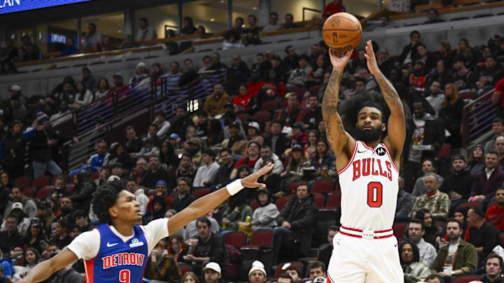 Feb 12, 2025; Chicago, Illinois, USA;  Chicago Bulls guard Coby White (0) shoots against Detroit Pistons forward Ausar Thompson (9)