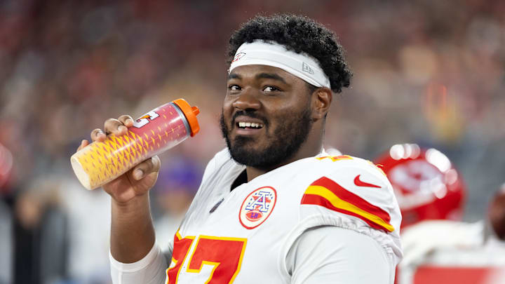Aug 9, 2025; Glendale, Arizona, USA; Kansas City Chiefs guard Jaylon Moore (77) against the Arizona Cardinals during a preseason NFL game at State Farm Stadium. Mandatory Credit: Mark J. Rebilas-Imagn Images
