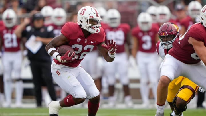 Sep 10, 2022; Stanford, California, USA; Stanford Cardinal running back E.J. Smith (22) runs with the football during the first quarter against the USC Trojans at Stanford Stadium. Mandatory Credit: Stan Szeto-USA TODAY Sports Sep 10, 2022; Stanford, California, USA; Stanford Cardinal running back E.J. Smith (22) runs with the football during the first quarter against the USC Trojans at Stanford Stadium. Mandatory Credit: Stan Szeto-USA TODAY Sports
