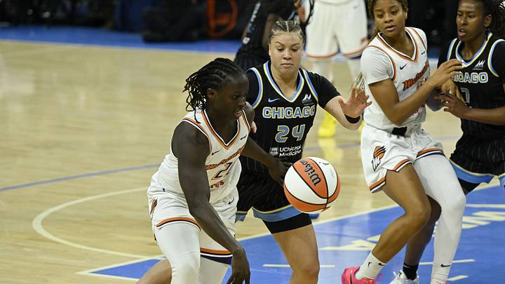 Jun 21, 2025; Chicago, Illinois, USA; Phoenix Mercury center Murjanatu Musa (20) moves the ball against Chicago Sky guard Rachel Banham (24) during the first half at Wintrust Arena. Mandatory Credit: Matt Marton-Imagn Images