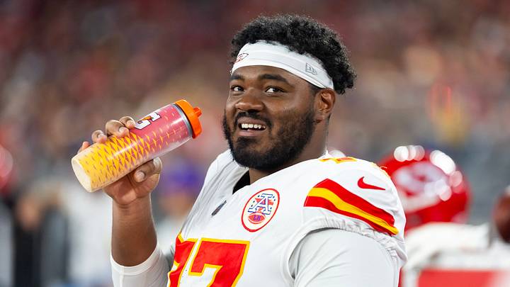 Aug 9, 2025; Glendale, Arizona, USA; Kansas City Chiefs guard Jaylon Moore (77) against the Arizona Cardinals during a preseason NFL game at State Farm Stadium. Mandatory Credit: Mark J. Rebilas-Imagn Images