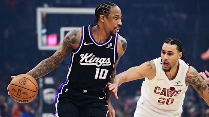 Jan 23, 2026; Cleveland, Ohio, USA; Sacramento Kings guard DeMar DeRozan (10) drives to the basket against Cleveland Cavaliers guard Jaylon Tyson (20) during the first quarter at Rocket Arena. Mandatory Credit: Ken Blaze-Imagn Images