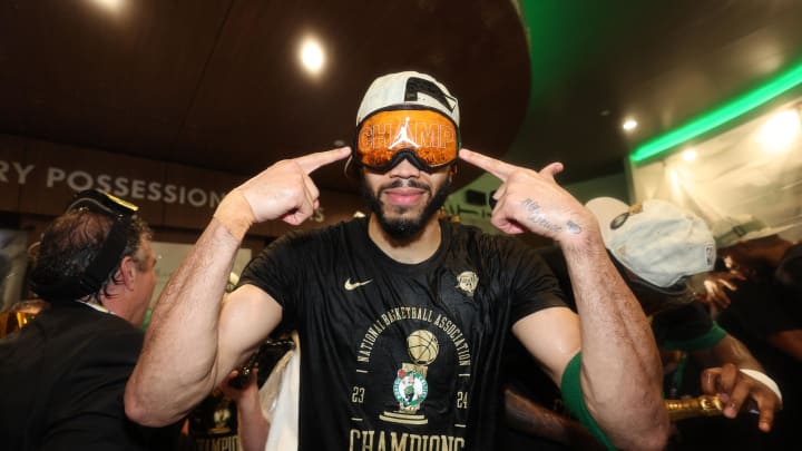 Jun 17, 2024; Boston, Massachusetts, USA; Boston Celtics forward Jayson Tatum (0) celebrates in the locker room after winning the 2024 NBA Finals against the Dallas Mavericks at TD Garden. Mandatory Credit: Elsa/Pool Photo-USA TODAY Sports
