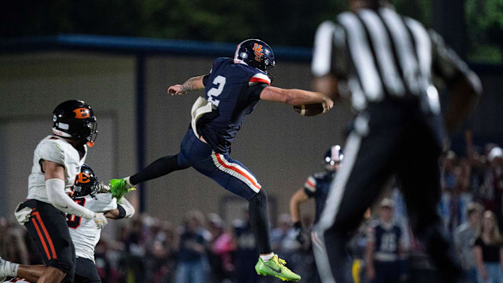 Nashville Christian's Jared Curtis (2) leaps for extra yardage against Ensworth during their game at Nashville Christian School in Nashville, Tenn., Friday, Aug. 29, 2025. Nashville Christian beat Ensworth 42-41 after going for a two-point conversion in overtime. Nashville Christian's Jared Curtis (2) leaps for extra yardage against Ensworth during their game at Nashville Christian School in Nashville, Tenn., Friday, Aug. 29, 2025. Nashville Christian beat Ensworth 42-41 after going for a two-point conversion in overtime.