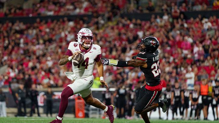 Oct 9, 2026; Louisville, Kentucky, USA;  Florida State Seminoles quarterback Ashton Daniels (14) looks for a pass during the second quarter against the Louisville Cardinals at L&N Federal Credit Union Stadium.  Mandatory Credit: Chris Carter-Imagn Images