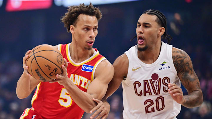 Nov 2, 2025; Cleveland, Ohio, USA; Atlanta Hawks guard Dyson Daniels (5) drives to the basket against Cleveland Cavaliers guard Jaylon Tyson (20) during the first quarter at Rocket Arena. Mandatory Credit: Ken Blaze-Imagn Images
