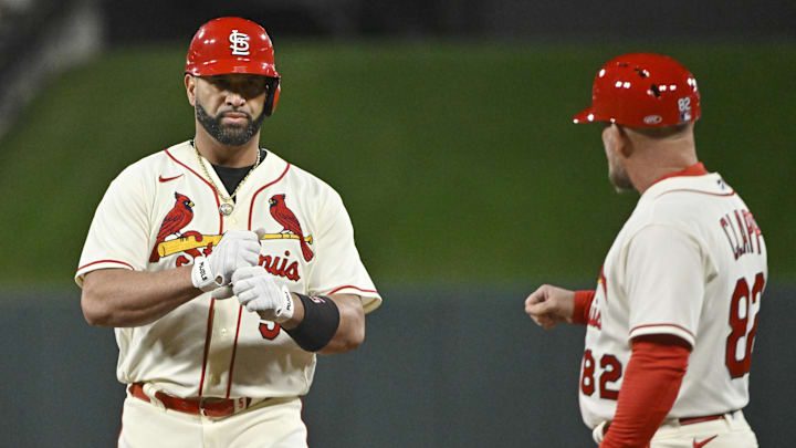 Oct 8, 2022; St. Louis, Missouri, USA; St. Louis Cardinals designated hitter Albert Pujols (5) reacts after his single in the sixth inning against the Philadelphia Phillies during game two of the Wild Card series for the 2022 MLB Playoffs at Busch Stadium. Mandatory Credit: Jeff Curry-Imagn Images Oct 8, 2022; St. Louis, Missouri, USA; St. Louis Cardinals designated hitter Albert Pujols (5) reacts after his single in the sixth inning against the Philadelphia Phillies during game two of the Wild Card series for the 2022 MLB Playoffs at Busch Stadium. Mandatory Credit: Jeff Curry-Imagn Images