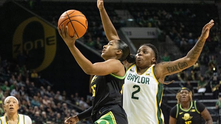 Oregon’s Deja Kelly, left, goes up for a shot ahead of Baylor’s Yaya Felder in the 4th quarter at Matthew Knight Arena in Eugene.