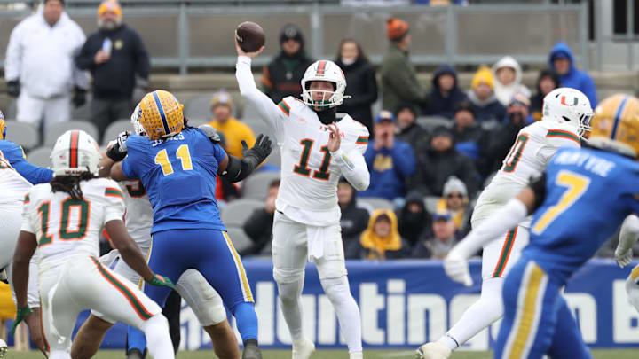 Nov 29, 2025; Pittsburgh, Pennsylvania, USA;  Miami Hurricanes quarterback Carson Beck (11) passes the ball against the Pittsburgh Panthers during the second quarter at Acrisure Stadium. Mandatory Credit: Charles LeClaire-Imagn Images