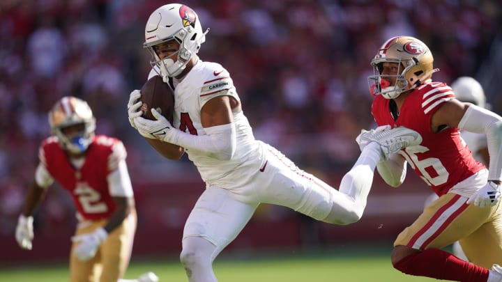 Oct 1, 2023; Santa Clara, California, USA; Arizona Cardinals wide receiver Michael Wilson (14) catches a pass in front of San Francisco 49ers cornerback Isaiah Oliver (26) in the fourth quarter at Levi's Stadium. Mandatory Credit: Cary Edmondson-USA TODAY Sports