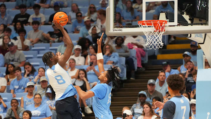 Oct 4, 2025; Charlotte, NC, USA; North Carolina Tar Heels forward Caleb Wilson (8) shoots as forward Jarin Stevenson (15) defends in the second half at Dean E. Smith Center. Mandatory Credit: Bob Donnan-Imagn Images