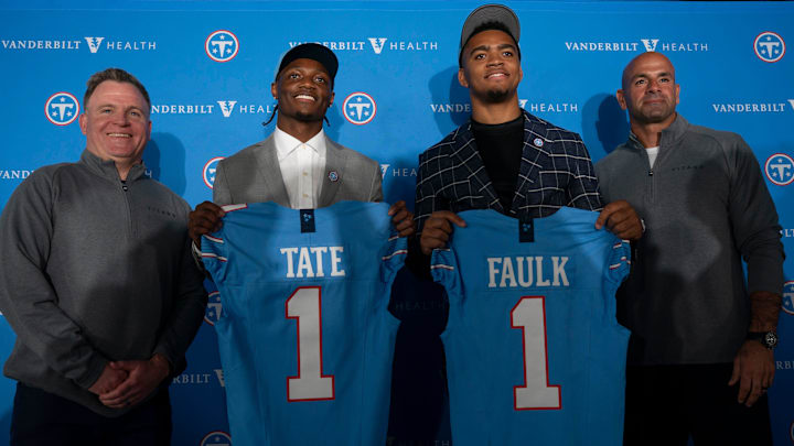 Tennessee Titans first round draft picks wide receiver Carnell Tate, second left, and edge Keldric Faulk stand for pictures with Mike Borgonzi, general manager, left, and Coach Robert Saleh at Vanderbilt Health Football Center Friday, April 24, 2026.