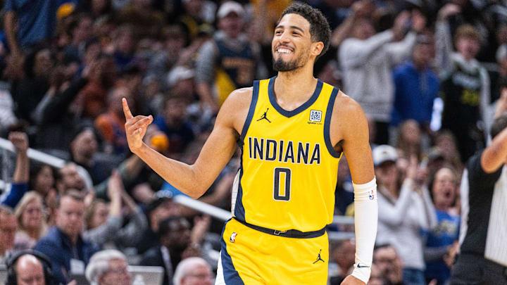 Nov 10, 2024; Indianapolis, Indiana, USA;  Indiana Pacers guard Tyrese Haliburton (0) celebrates a made basket in the  second half against the New York Knicks at Gainbridge Fieldhouse. Mandatory Credit: Trevor Ruszkowski-Imagn Images