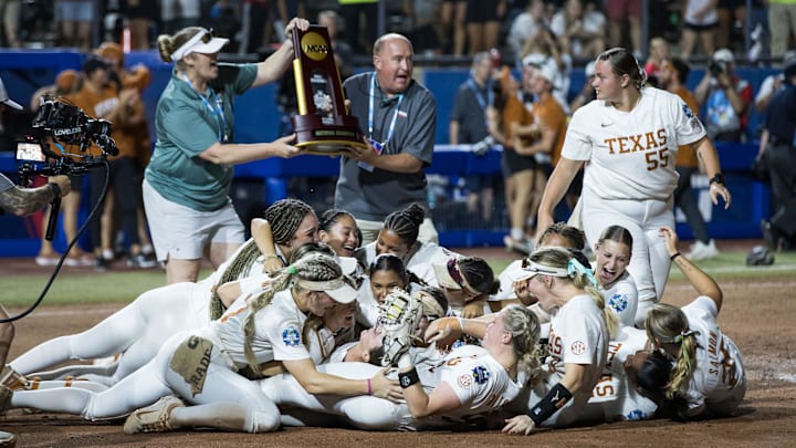 Jun 6, 2025; Oklahoma City, OK, USA;  Texas Longhorns players dogpile after beating the Texas Tech Red Raiders 10-4 to win the National Championship in game three of the NCAA Softball Women's College World Series finals at Devon Park. Mandatory Credit: Brett Rojo-Imagn Images