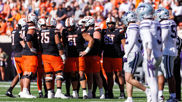 Nov 15, 2025; Stillwater, Oklahoma, USA; Oklahoma State Cowboys huddle during the first half against the Kansas State Wildcats at Boone Pickens Stadium. Mandatory Credit: William Purnell-Imagn Images Nov 15, 2025; Stillwater, Oklahoma, USA; Oklahoma State Cowboys huddle during the first half against the Kansas State Wildcats at Boone Pickens Stadium. Mandatory Credit: William Purnell-Imagn Images