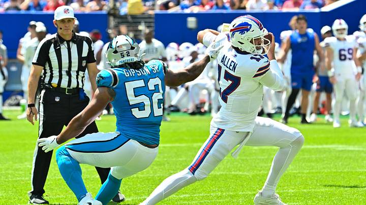 Buffalo Bills quarterback Josh Allen (17) avoids a tackle by Carolina Panthers defensive lineman Trevis Gipson Buffalo Bills quarterback Josh Allen (17) avoids a tackle by Carolina Panthers defensive lineman Trevis Gipson