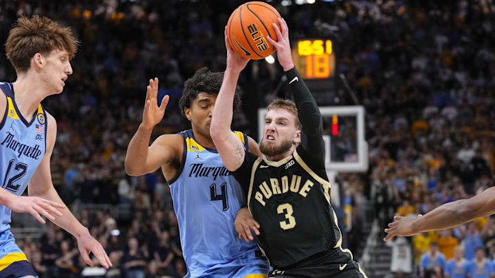 Purdue Boilermakers guard Braden Smith drives towards the basket around Marquette Golden Eagles guard Stevie Mitchell 