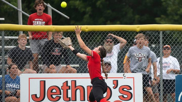 Western Dubuque's Carly Vogel dives for a ball at the fence during the 2025 Iowa high school state softball tournament at Harlan Rogers Sports Complex on July 21, 2025, in Fort Dodge. Western Dubuque's Carly Vogel dives for a ball at the fence during the 2025 Iowa high school state softball tournament at Harlan Rogers Sports Complex on July 21, 2025, in Fort Dodge.