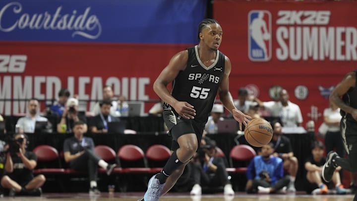 Jul 10, 2025; Las Vegas, NV, USA; San Antonio Spurs guard/forward Harrison Ingram (55) dribbles the ball against the Philadelphia 76ers in the third quarter of their game at Thomas & Mack Center. Mandatory Credit: Candice Ward-Imagn Images