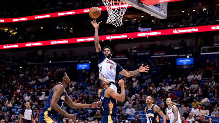 Jan 3, 2025; New Orleans, Louisiana, USA;  Washington Wizards forward Justin Champagnie (9) shoots against New Orleans Pelicans guard CJ McCollum (3) during the first half at Smoothie King Center. Mandatory Credit: Stephen Lew-Imagn Images
