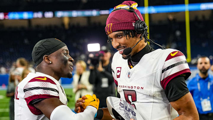 Washington Commanders quarterback Jayden Daniels is named Tom Brady’s LFG Player of the Game after defeating the Detroit Lions 45-31 in the NFL divisional round at Ford Field in Detroit, Saturday, Jan. 18, 2025. He is congratulated by rookie cornerback Mike Sainristil, who had two interceptions.