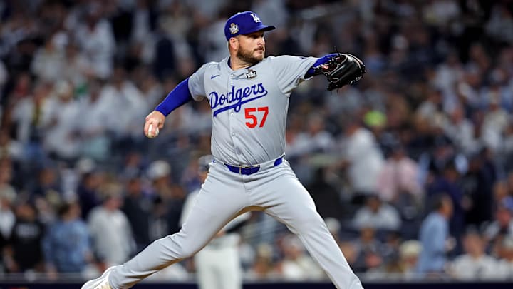 Oct 30, 2024; New York, New York, USA; Los Angeles Dodgers pitcher Ryan Brasier (57) pitches during the third inning against the New York Yankees in game four of the 2024 MLB World Series at Yankee Stadium. Mandatory Credit: Brad Penner-Imagn Images